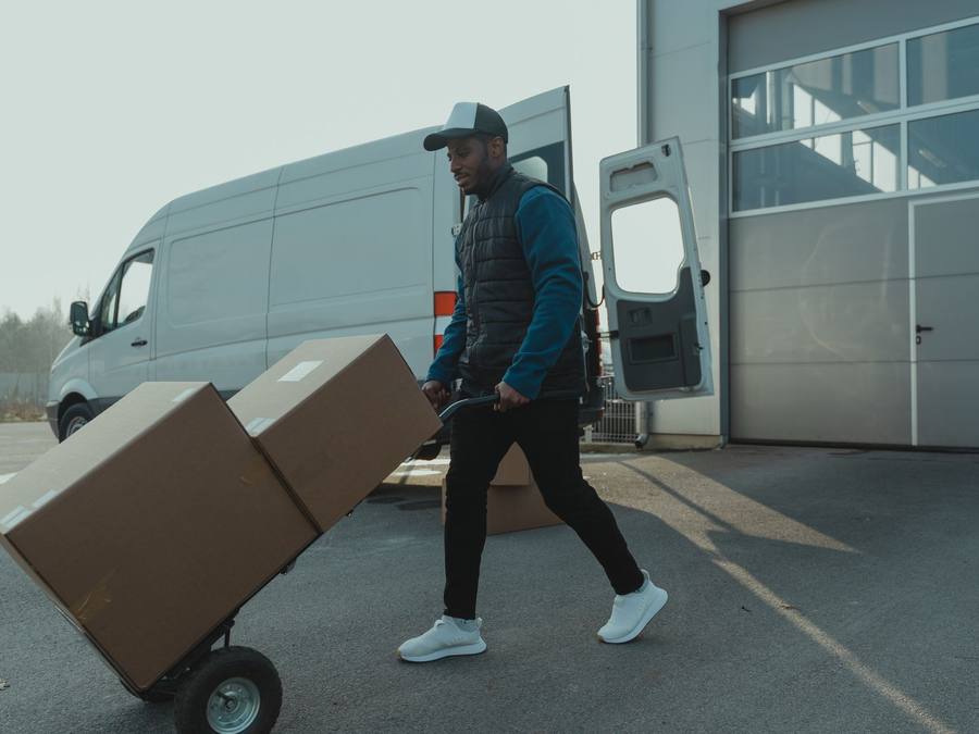 Calgary movers strapping a three-piece slate pool table for transport, Western Provincial Movers